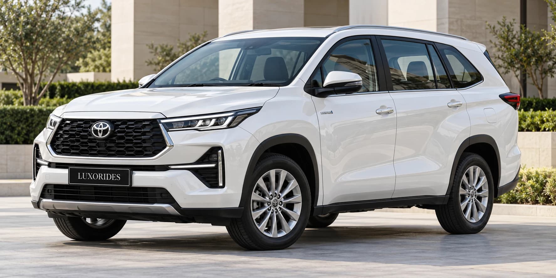 White Toyota Innova Hycross on rent from Luxorides