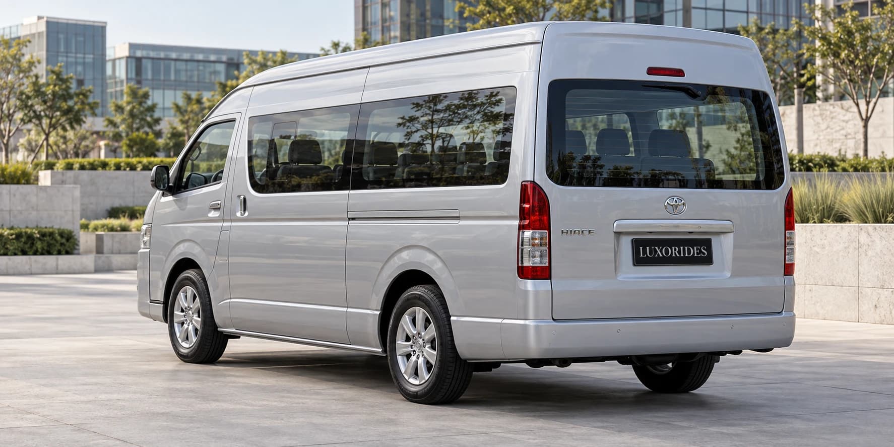 Back view of Silver Toyota Hiace from Luxorides