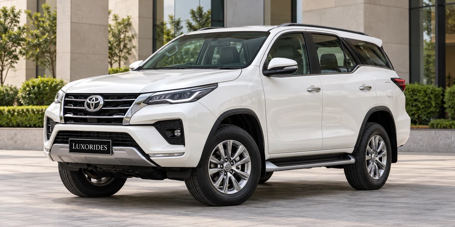 White Toyota Fortuner on rent from Luxorides