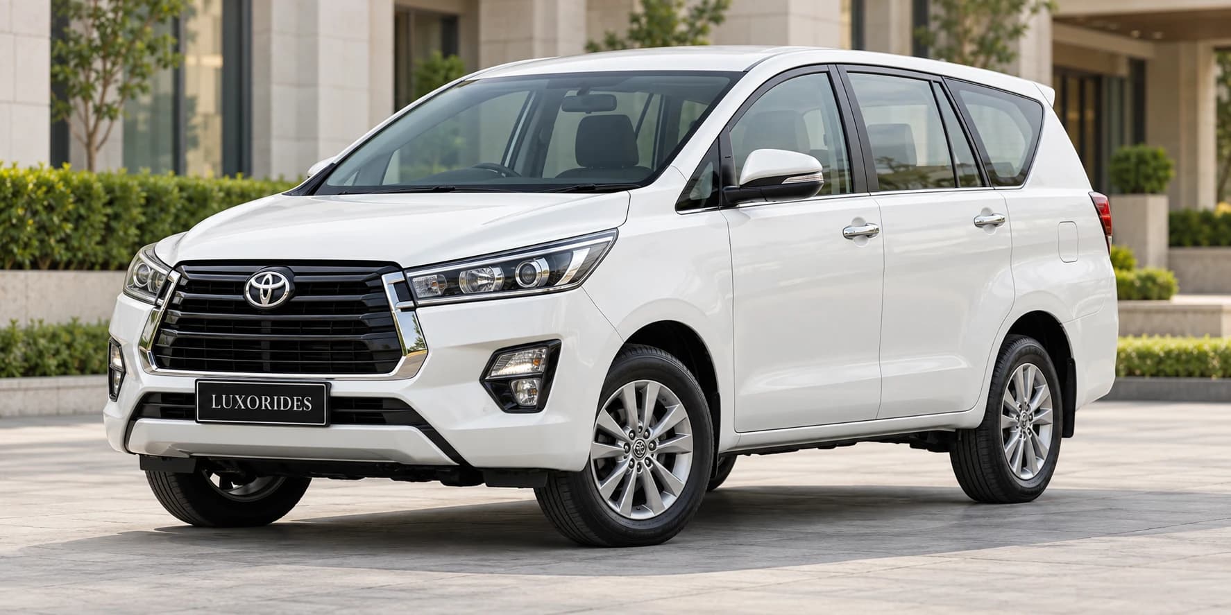 White Toyota Innova Crysta on rent from Luxorides