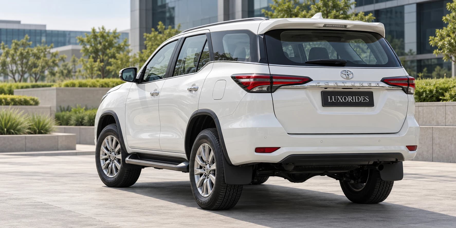 Back View of White Fortuner from Luxorides